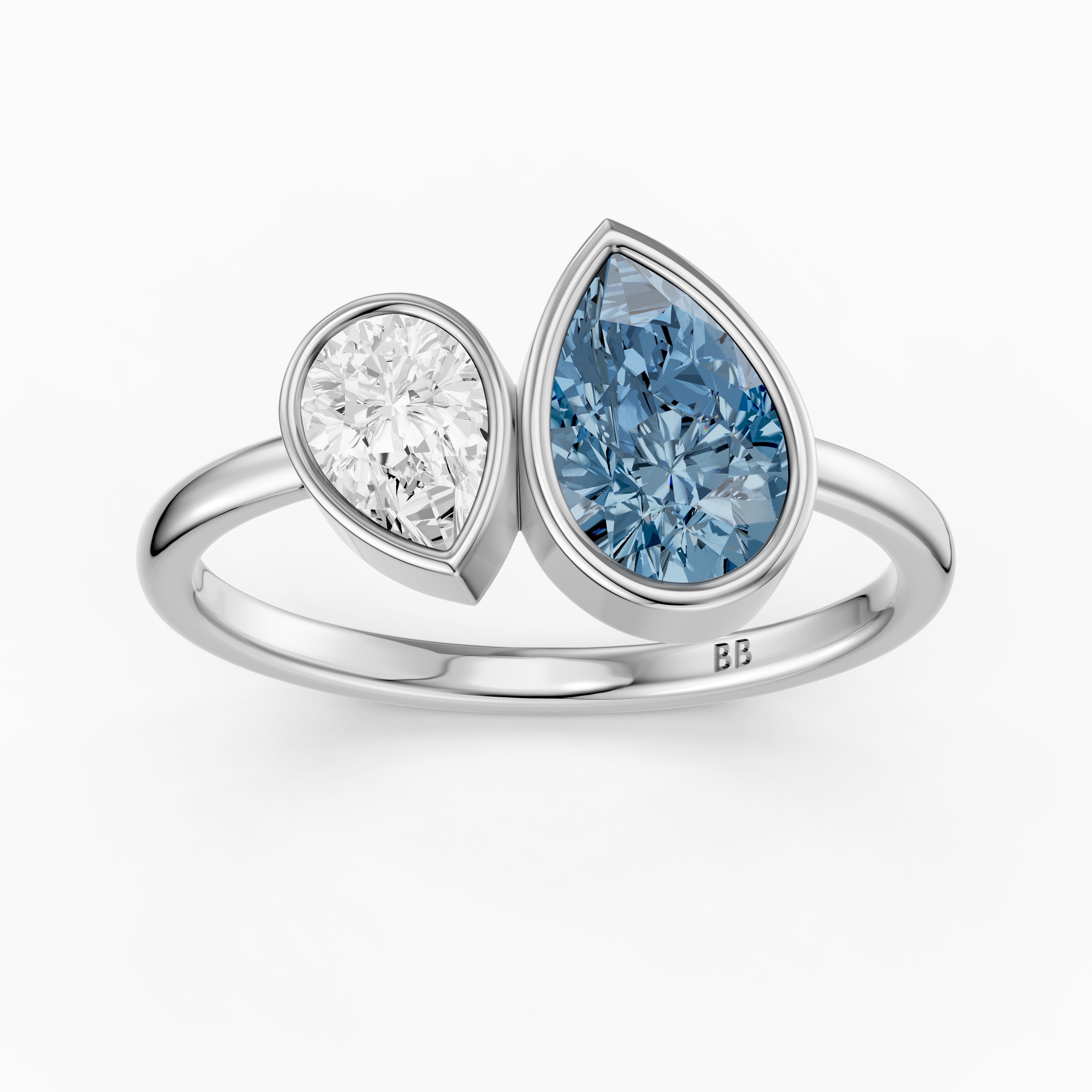 Nicolina Blue and White Pear Cut Colored Lab Grown Diamond Toi et Moi Bezel Ring