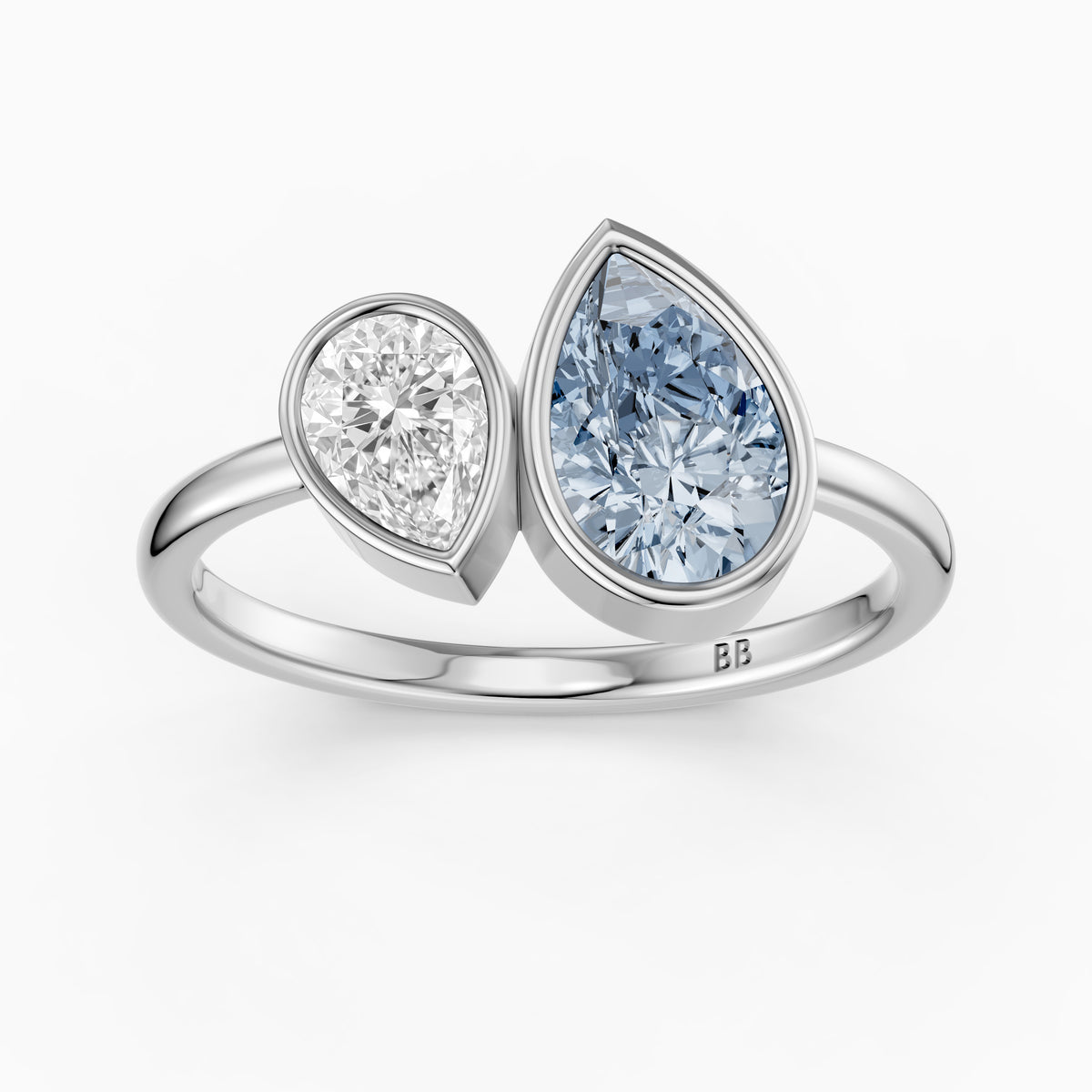 Nicolina Blue and White Pear Cut Colored Lab Grown Diamond Toi et Moi Bezel Ring