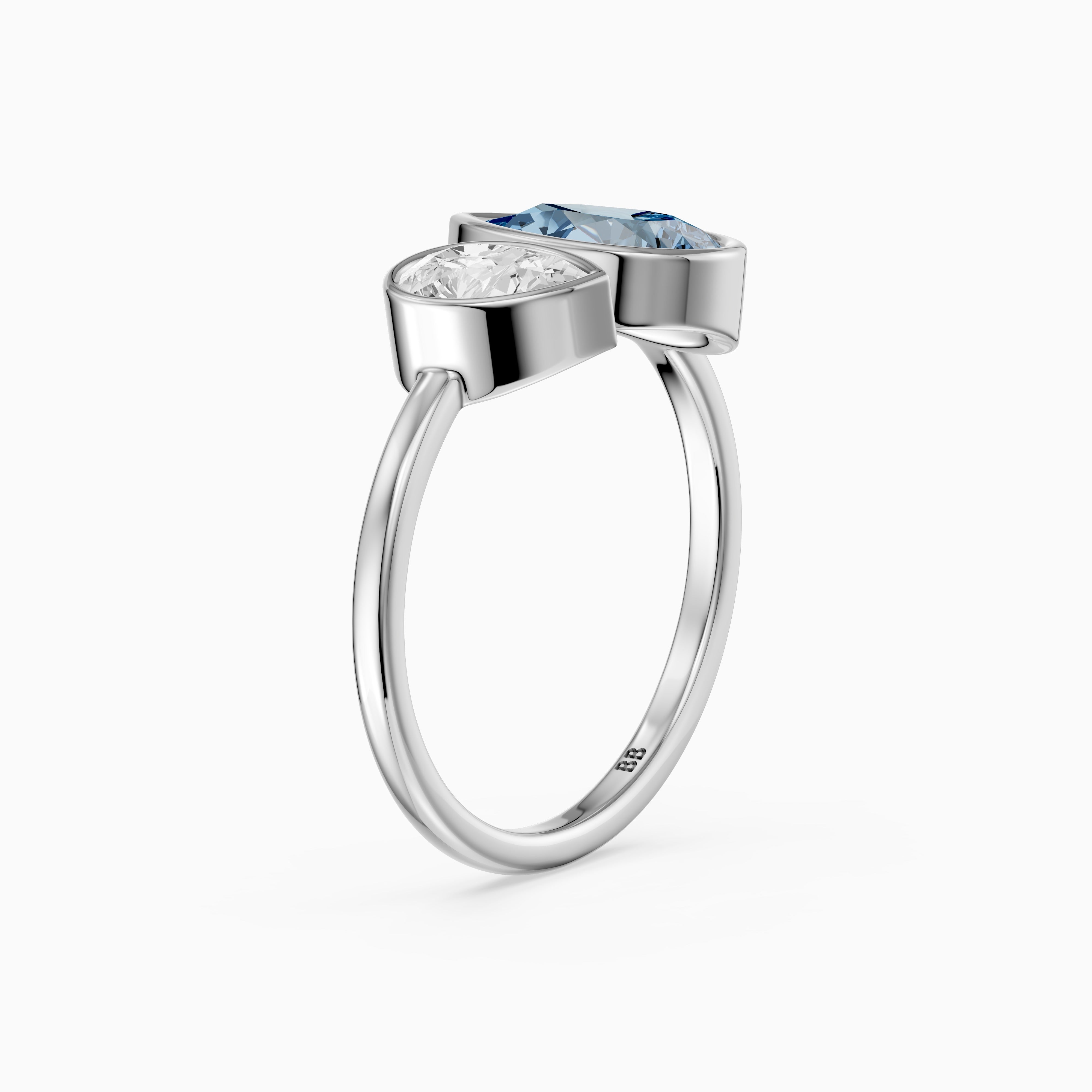 Nicolina Blue and White Pear Cut Colored Lab Grown Diamond Toi et Moi Bezel Ring