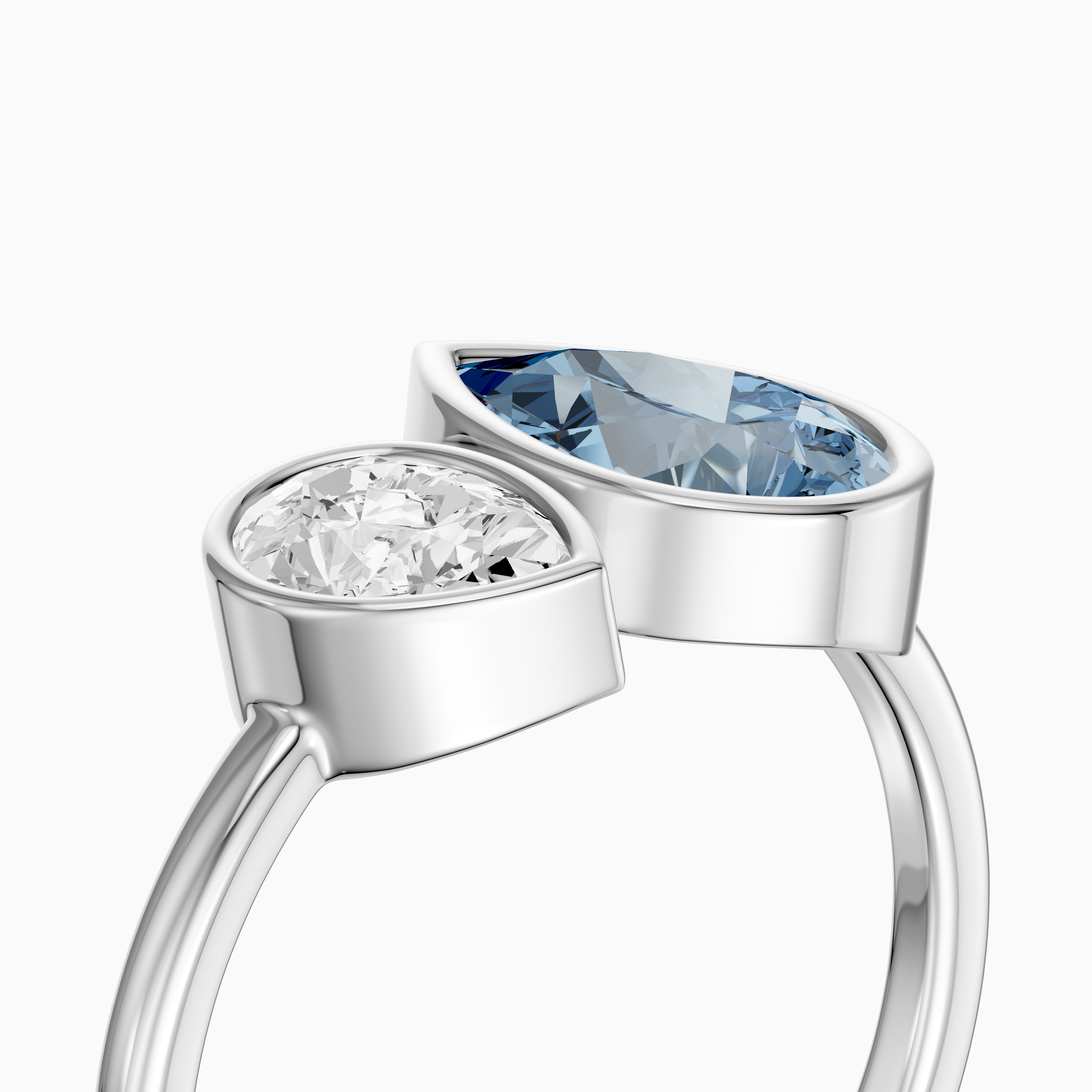 Nicolina Blue and White Pear Cut Colored Lab Grown Diamond Toi et Moi Bezel Ring