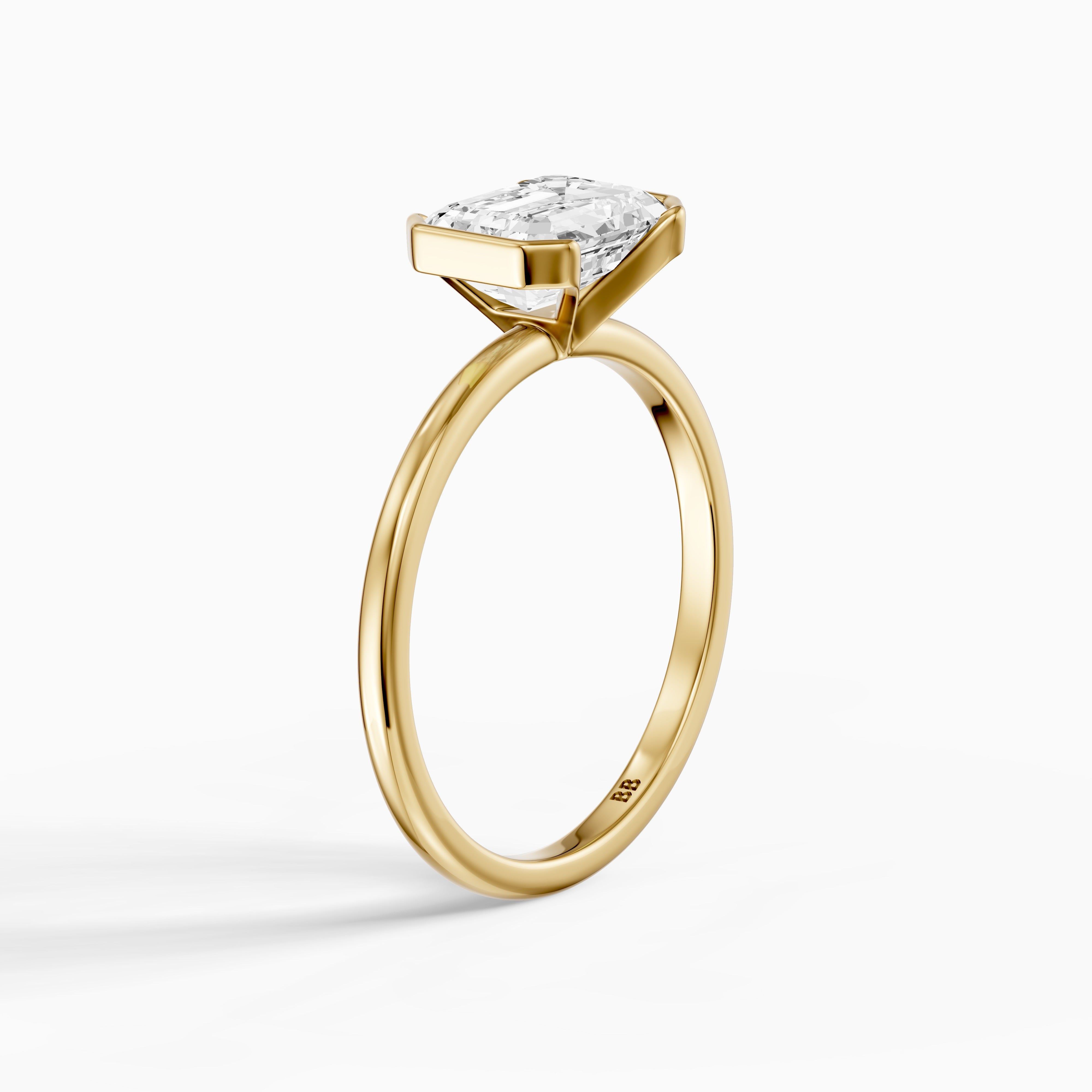 Kierra Emerald Half Bezel East West Moissanite Diamond Ring