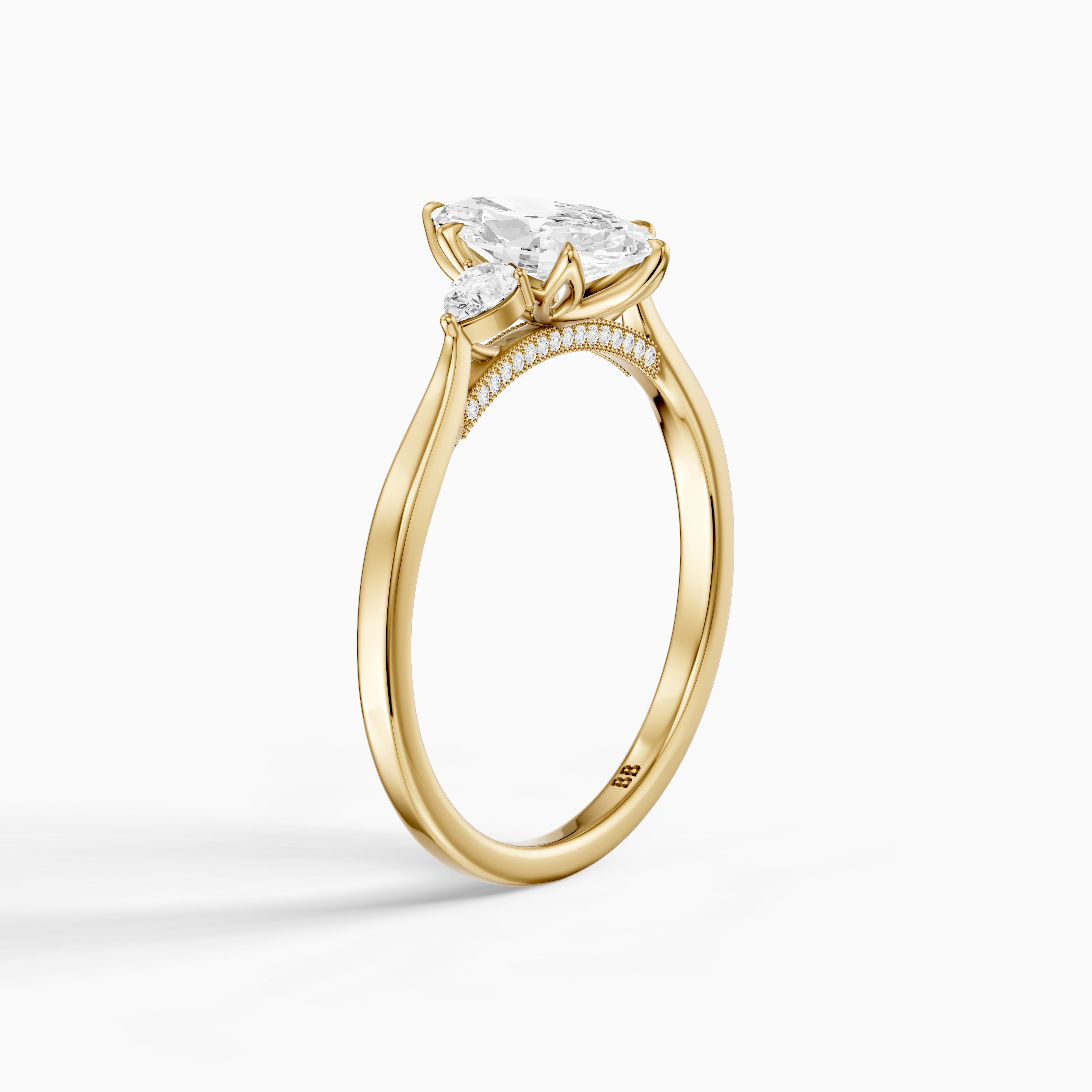 Hazel Marquise Three Stone Moissanite Ring in Tulip Cathedral Setting