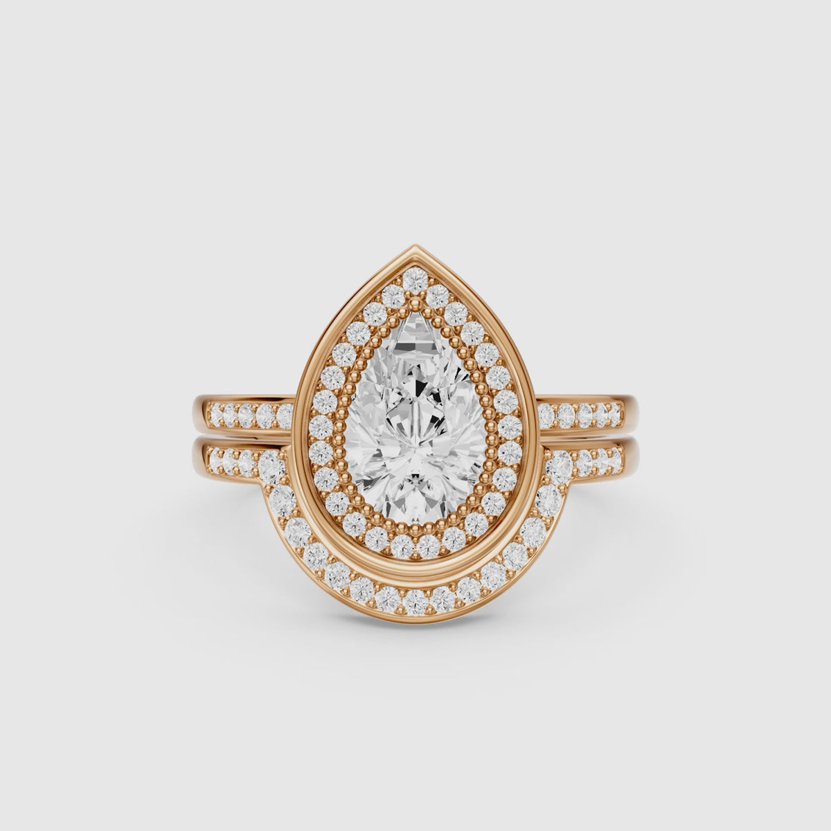 Load video: Cameron Pear Shaped Lab Grown Diamond Halo Bridal Set with Contour Band