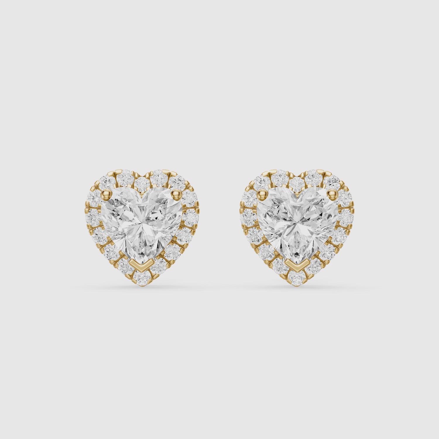 Load video: Zinaida Heart Shape Lab Grown Diamond Halo Stud Earrings