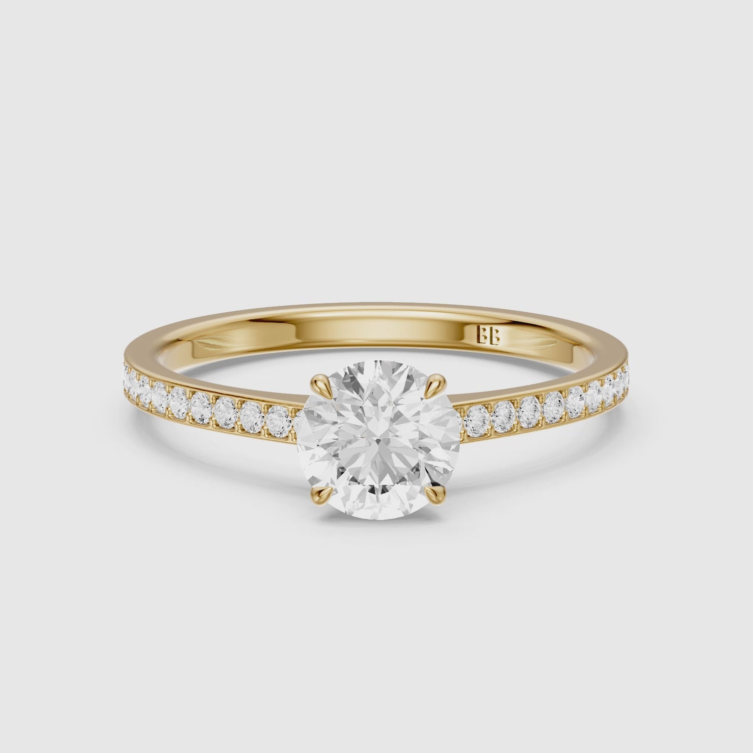Load video: Alyssa Round Cut Side Stone Channel Set Moissanite Diamond Ring