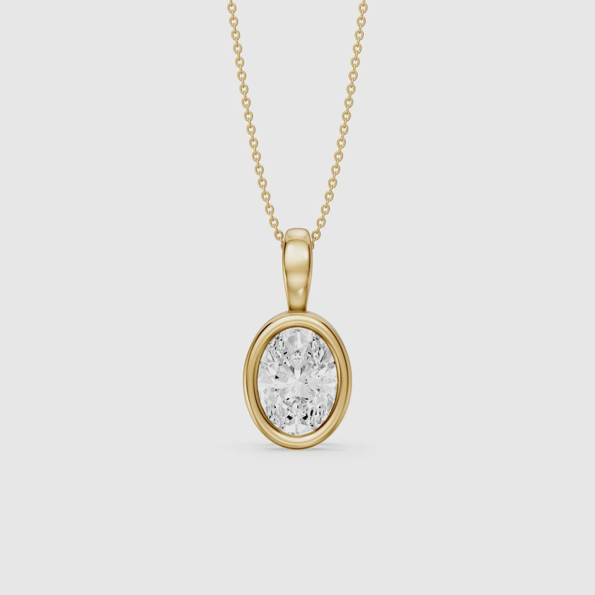 Load video: Bess Oval Shape Bezel Set Lab Grown Diamond Solitaire Pendant