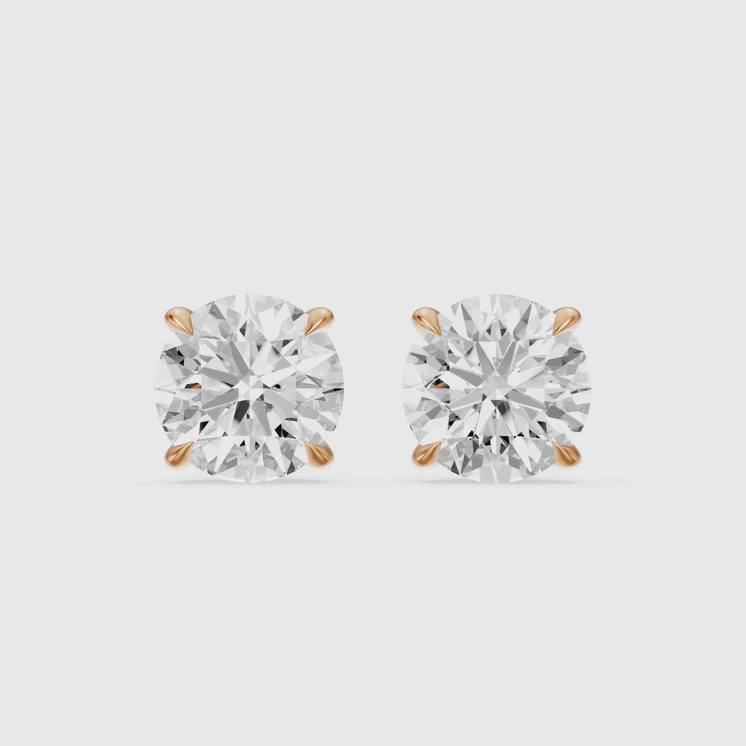 Load video: Roos Round Cut Lab Grown Diamond Four Prong Martini Earrings