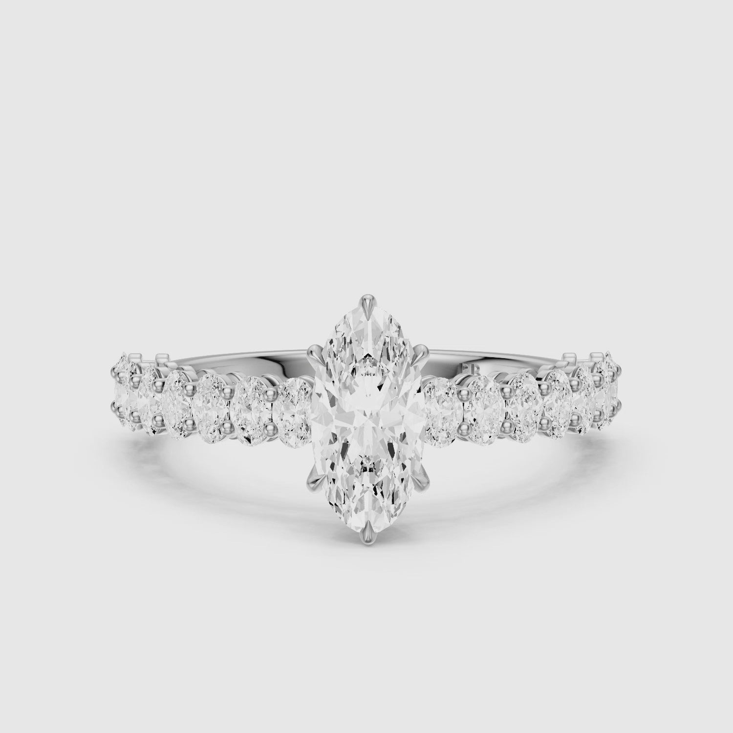 Load video: Sybil Moval Cut Moissanite Diamond Ring with Oval Side Diamond Band