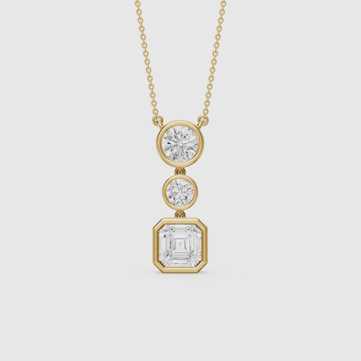 Load video: Vanessa Asscher Cut and Round Cut Lab Grown Diamond Bezel Three Stone Pendant