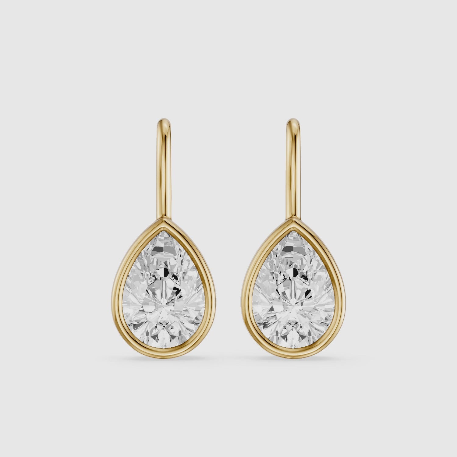 Load video: Brinley Bezel Set Pear Lab Grown Diamond Drop Earrings