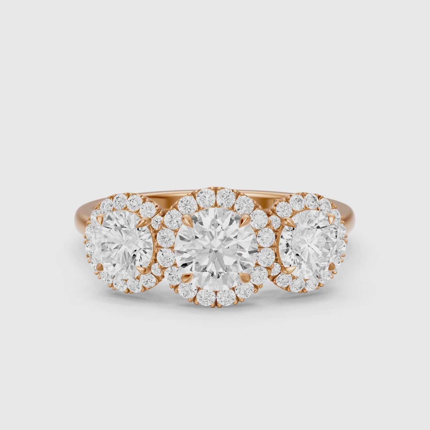 Load video: Ashley Three Stone Round Halo Lab Grown Diamond Ring