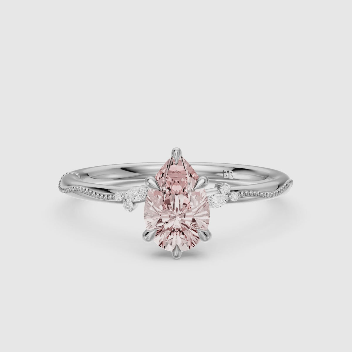 Load video: Bria Pear Cut Pink Lab Grown Diamond Side Stone Ring with Milgrain Band
