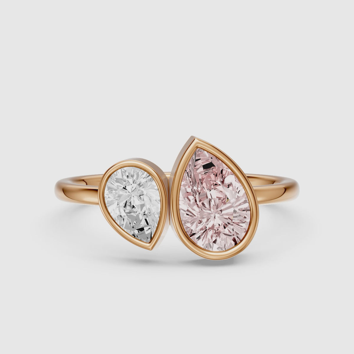 Load video: Prisca Pink and White Pear Cut Colored Lab Grown Diamond Toi et Moi Bezel Ring
