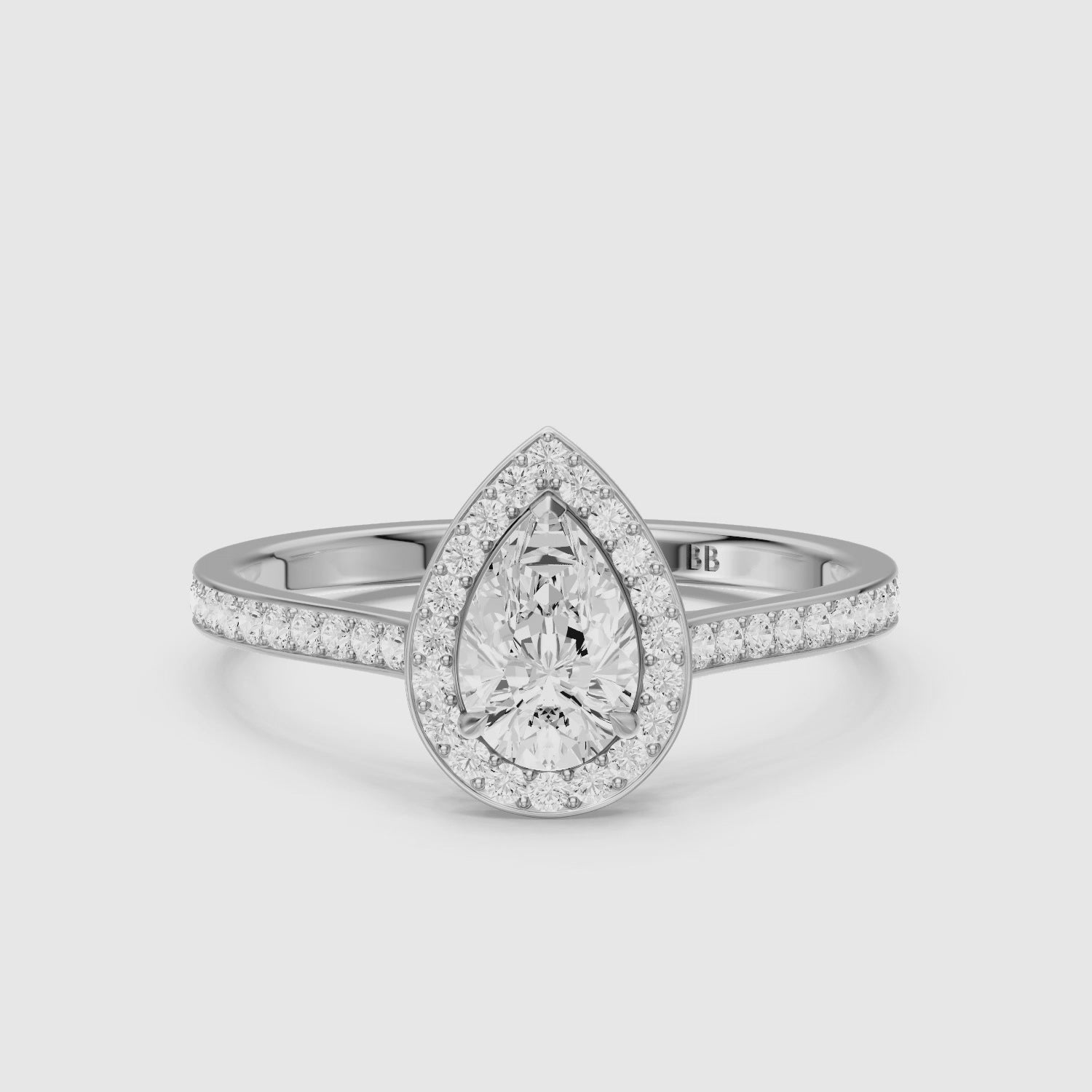 Load video: Darcie Pear Cut Halo Channel Set Lab Grown Diamond Ring