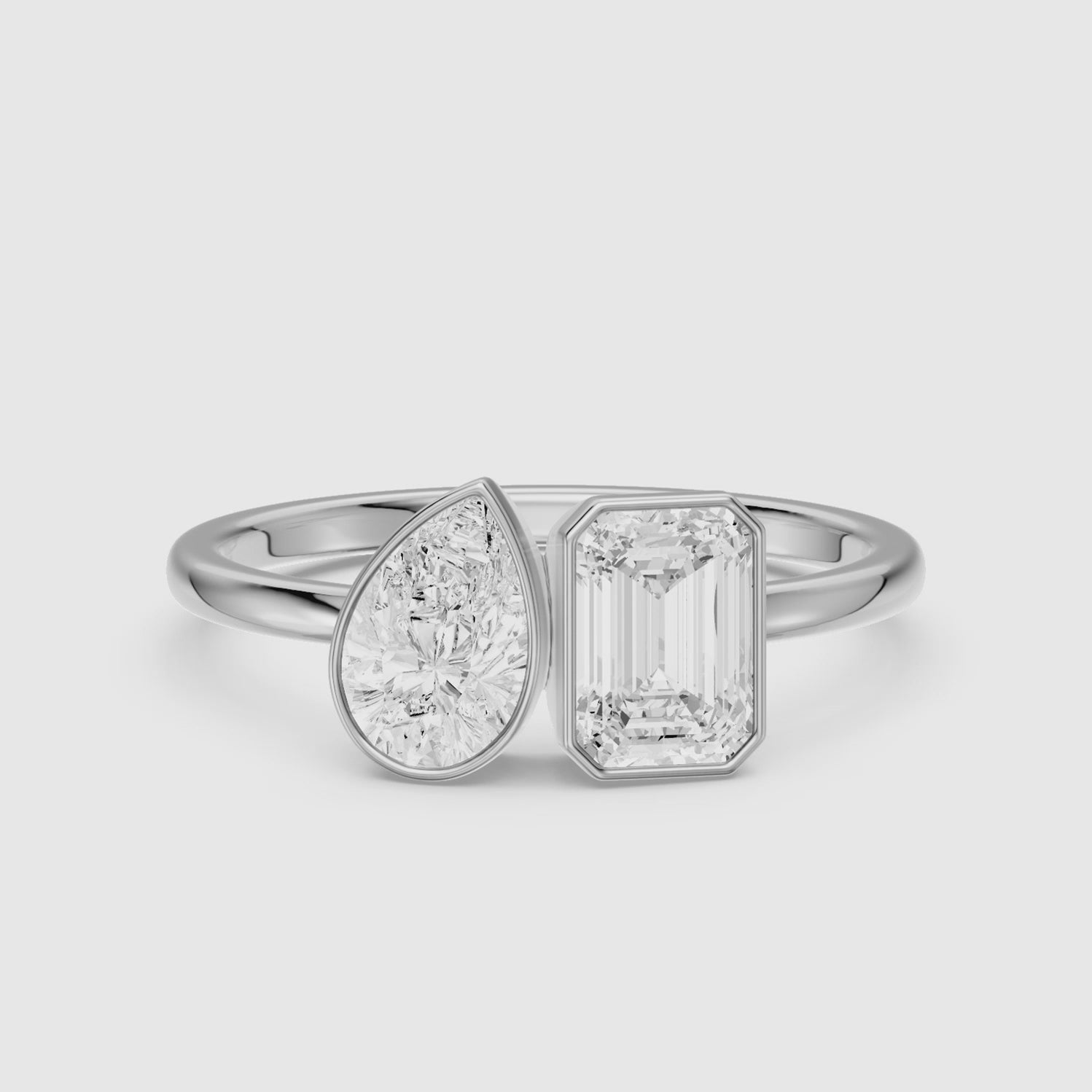 Load video: Cierra Toi Et Moi Bezel Diamond Ring With Pear and Emerald Two Stone Lab Grown Diamond