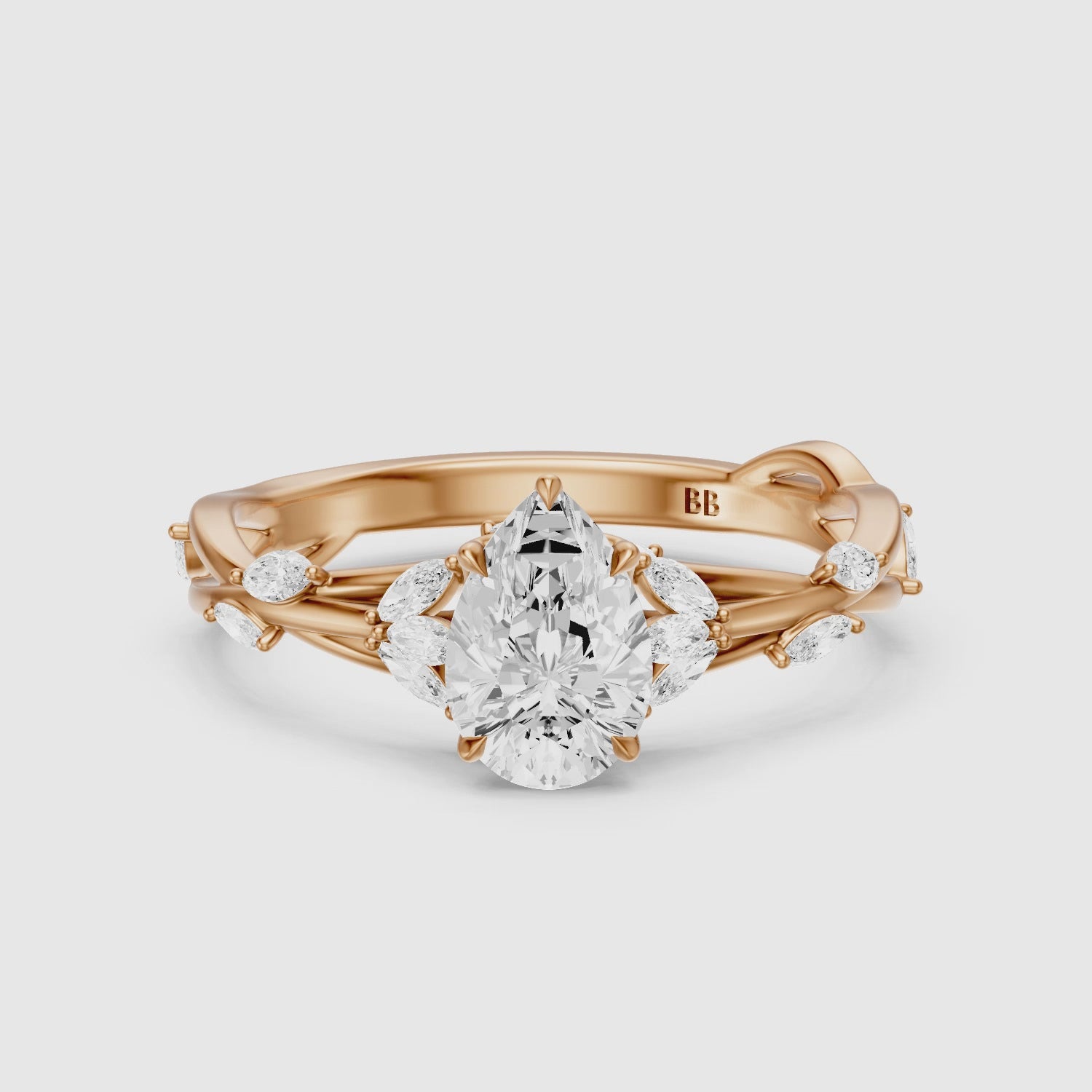 Load video: Luna Pear Cut Marquise Side Stone Nature Inspired Moissanite Diamond Ring
