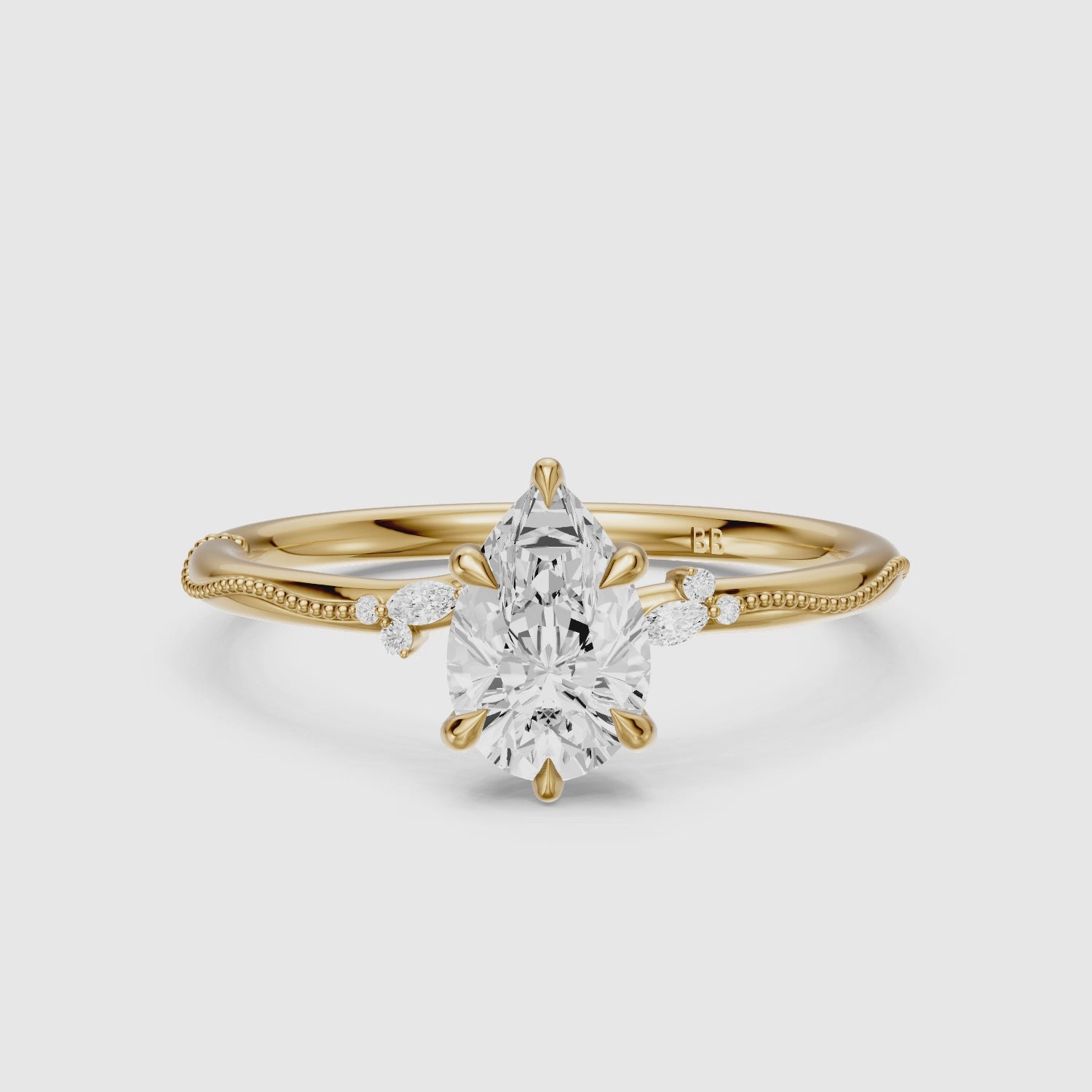 Load video: Cecilia Pear Cut Side Stone Lab Grown Diamond Ring with Milgrain Band