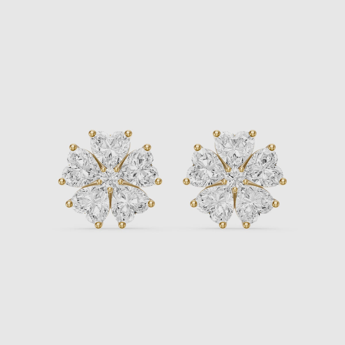 Load video: Zinnia Heart Shape Lab Grown Diamond Five Petal Flower Cluster Stud Earrings