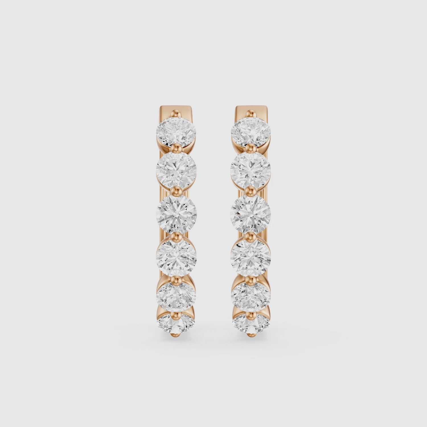 Load video: Yvette Round Cut Lab Grown Diamond Shared Prong Hoop Earrings