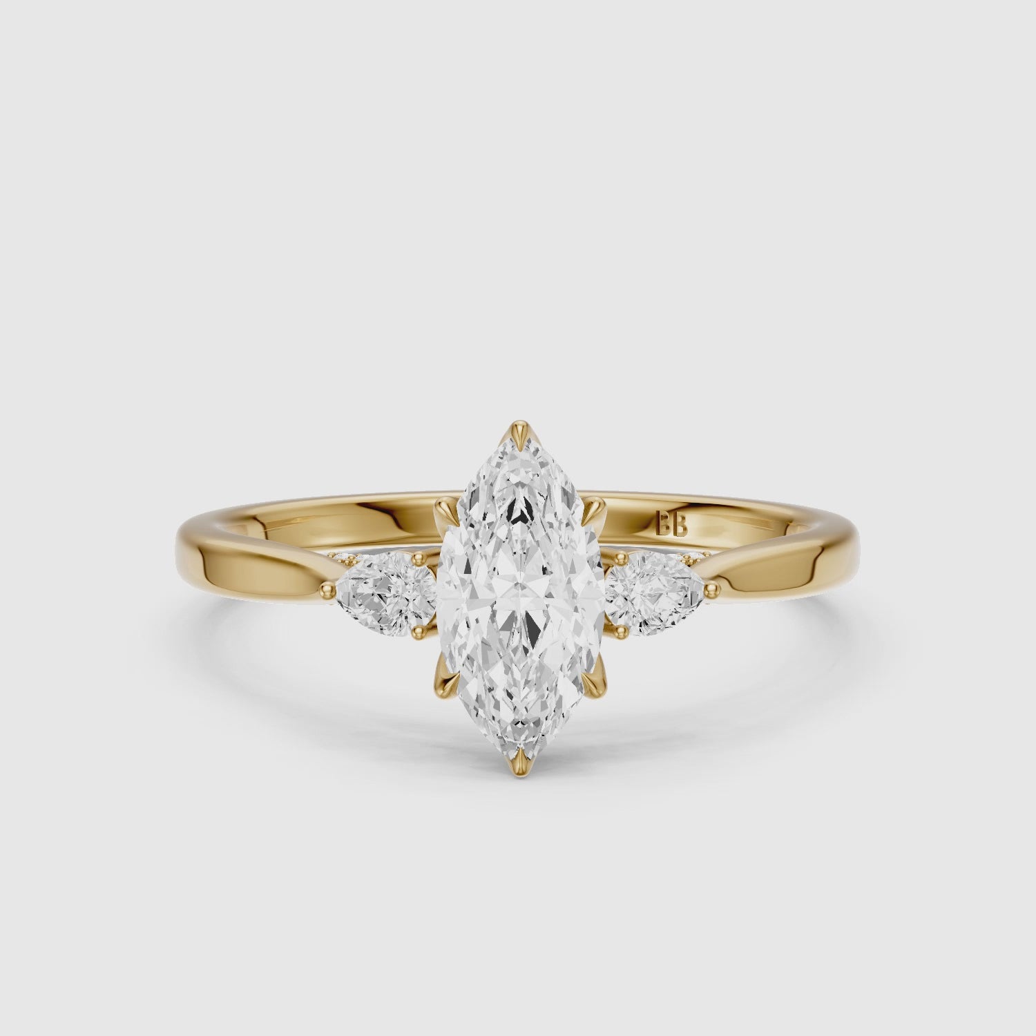 Load video: Hazel Marquise Three Stone Moissanite Ring in Tulip Cathedral Setting