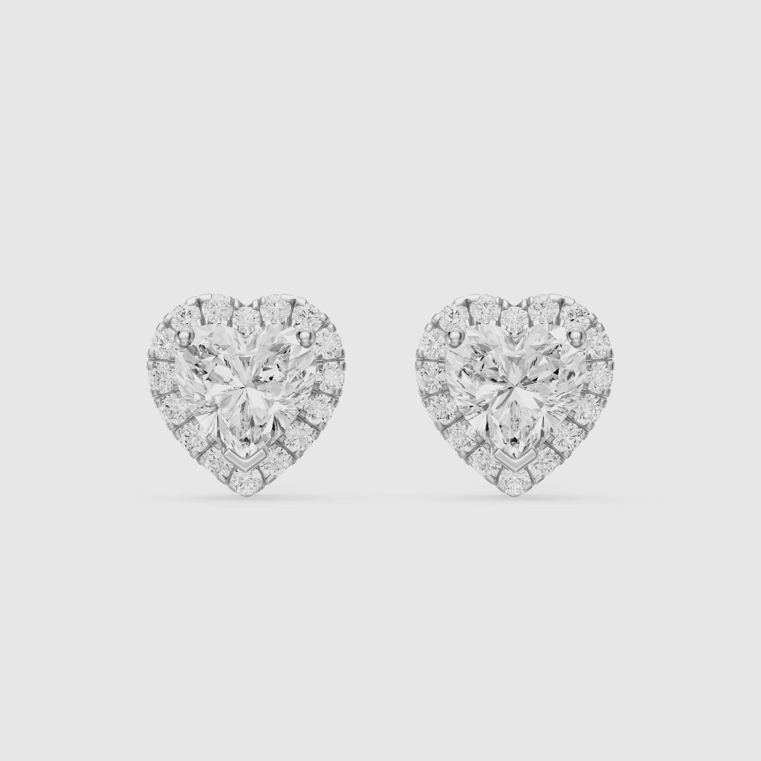 Load video: Zinaida Heart Shape Lab Grown Diamond Halo Stud Earrings