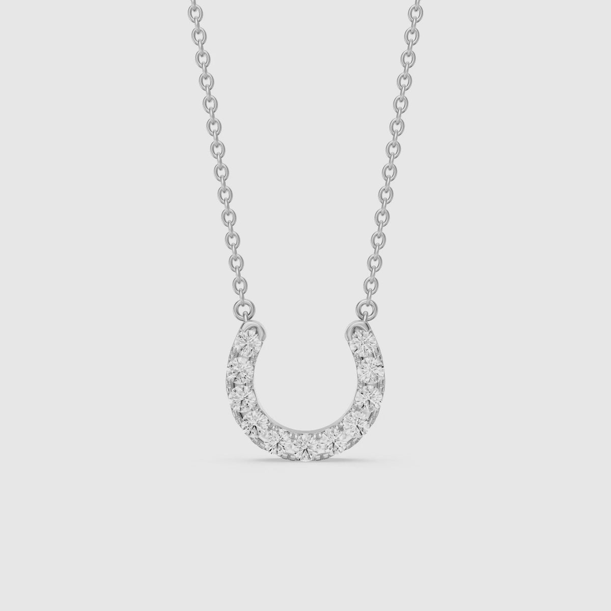 Load video: Amina Round Cut Lab Grown Diamond Horseshoe Pendant