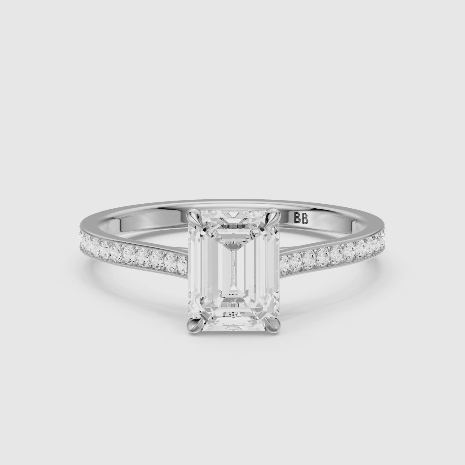 Load video: Raegan Emerald Cut Side Stone Channel Set Moissanite Diamond Ring