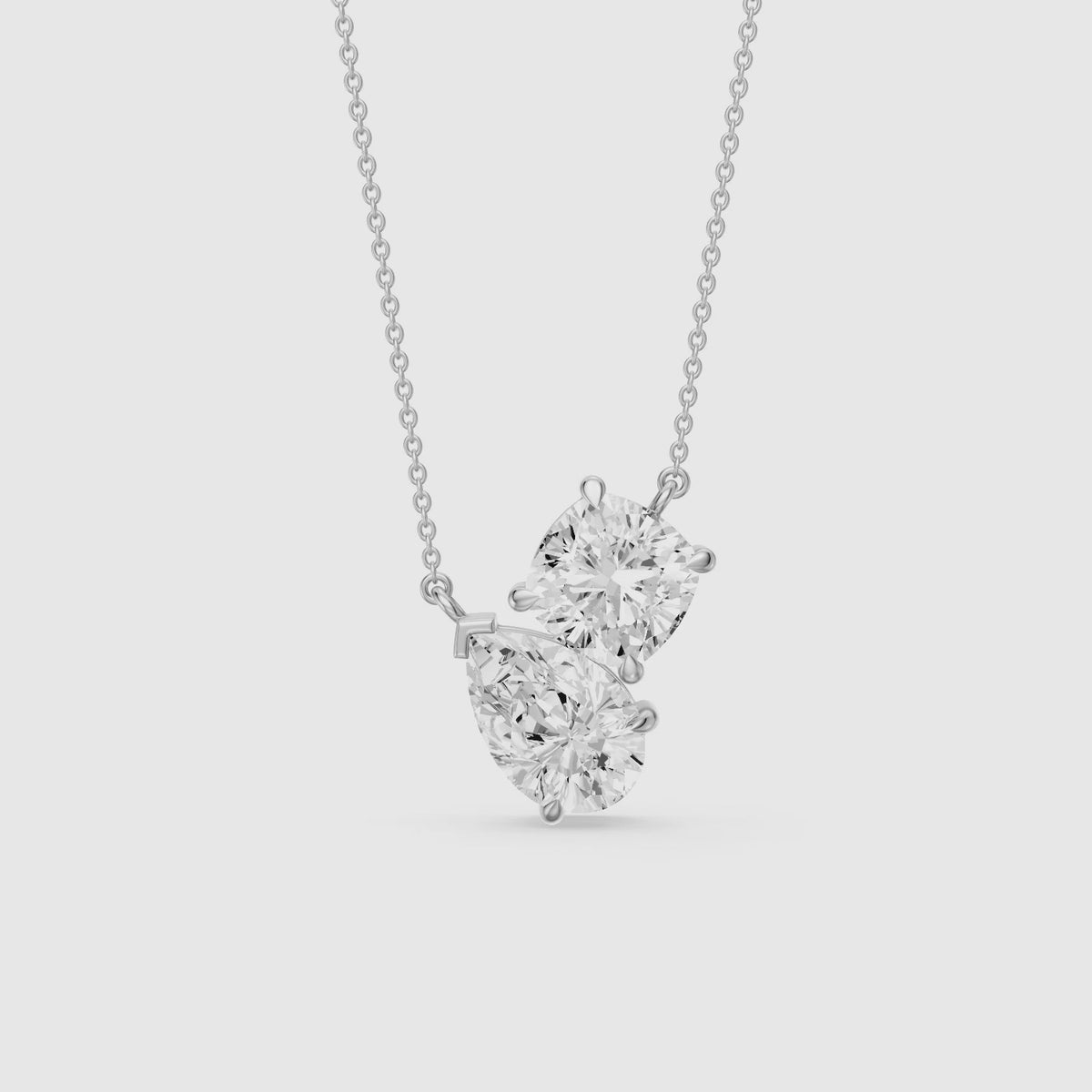 Load video: Kendall Pear and Round Lab Grown Diamond Toi Et Moi Pendant