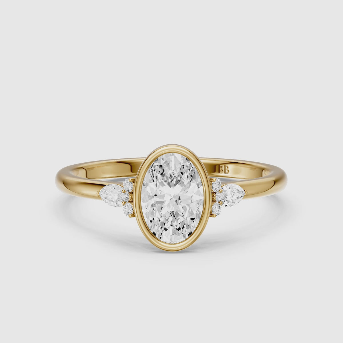 Load video: Lumi Oval Cut Bezel Lab Grown Diamond Engagement Ring with Pear Side Stones