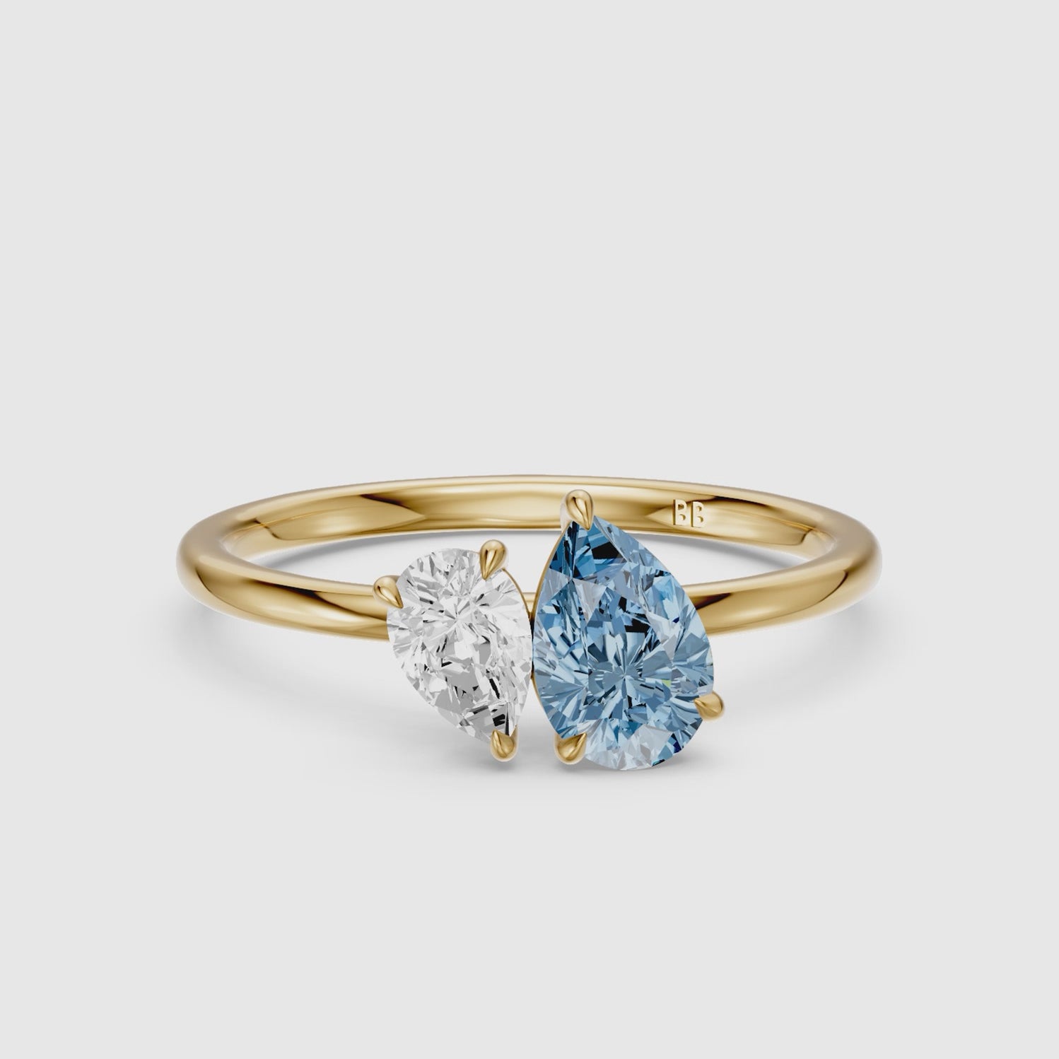 Load video: Livia Blue and White Graduated Pear Shape Color Lab Grown Diamond Toi et Moi Ring