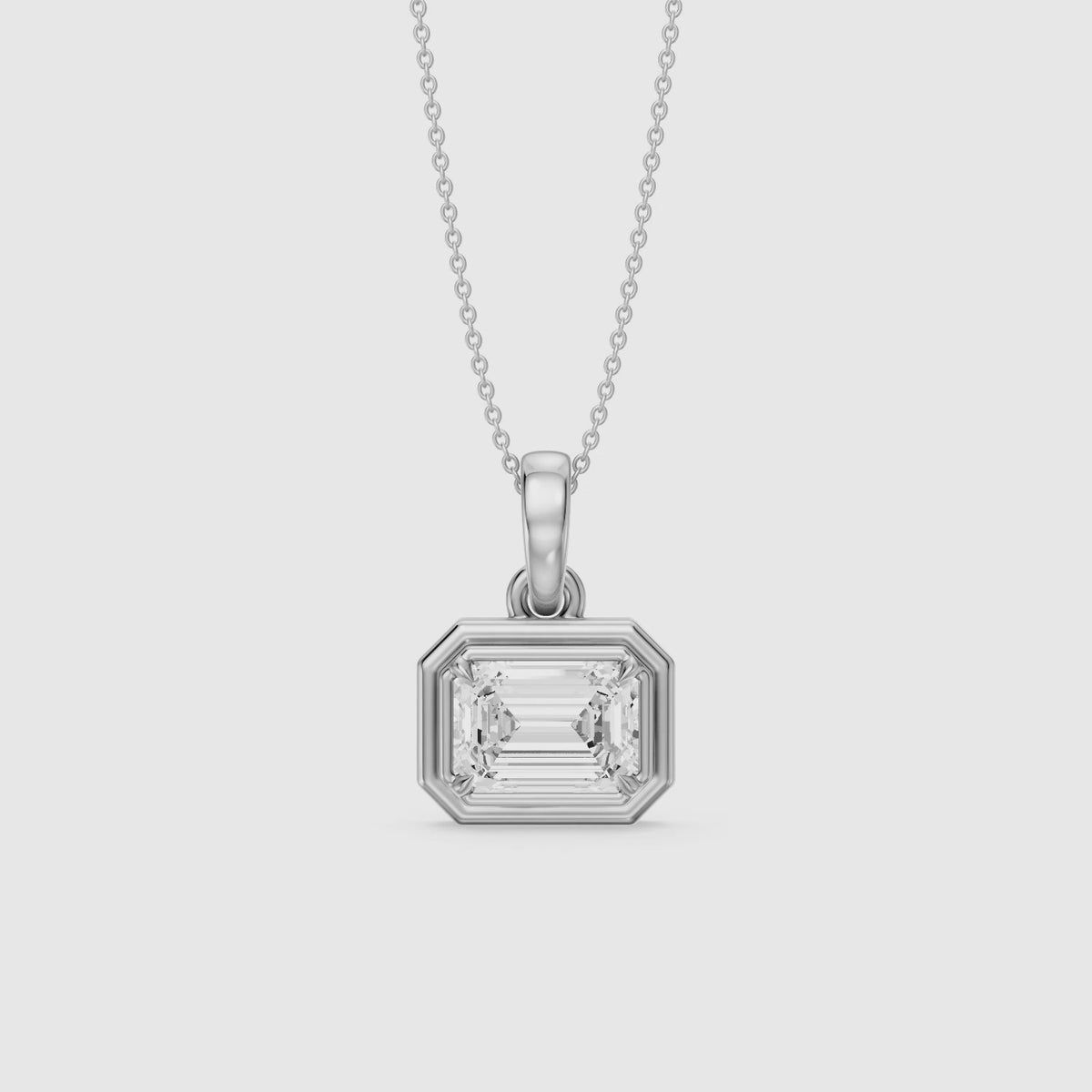 Load video: Leighton Emerald Cut Lab Grown Diamond East West Bezel Pendant