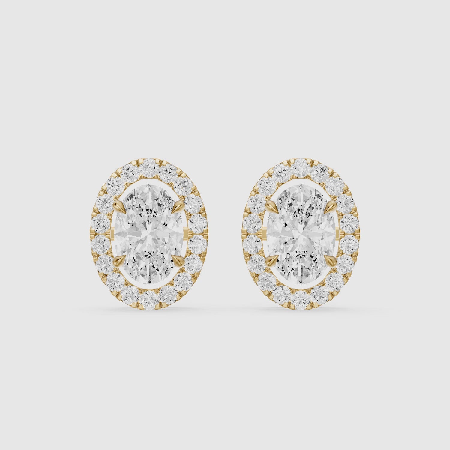 Load video: Vaida Oval Cut Lab Grown Diamond Halo Stud Earrings