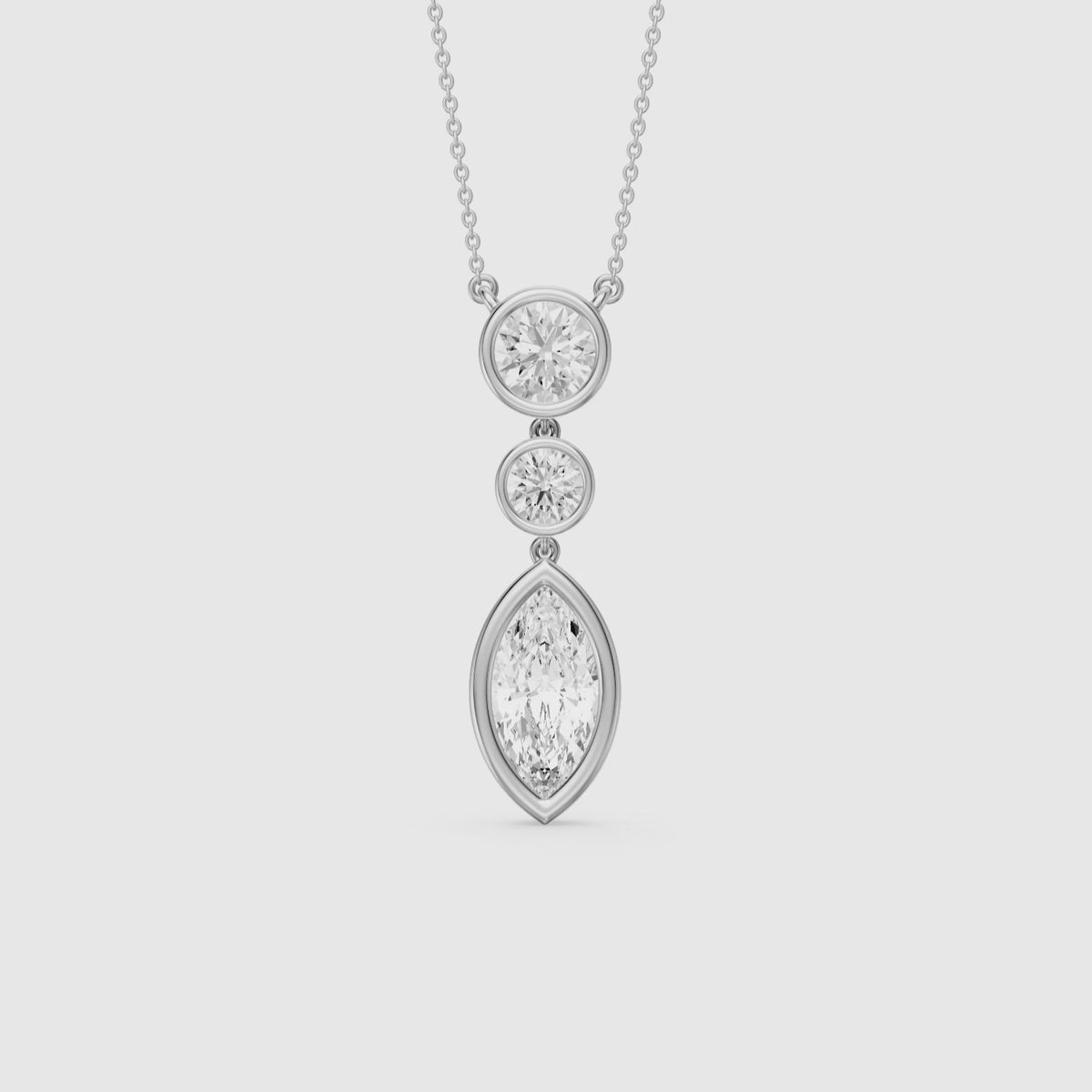 Load video: Astrid Marquise and Round Lab Grown Diamond Bezel Drop Pendant