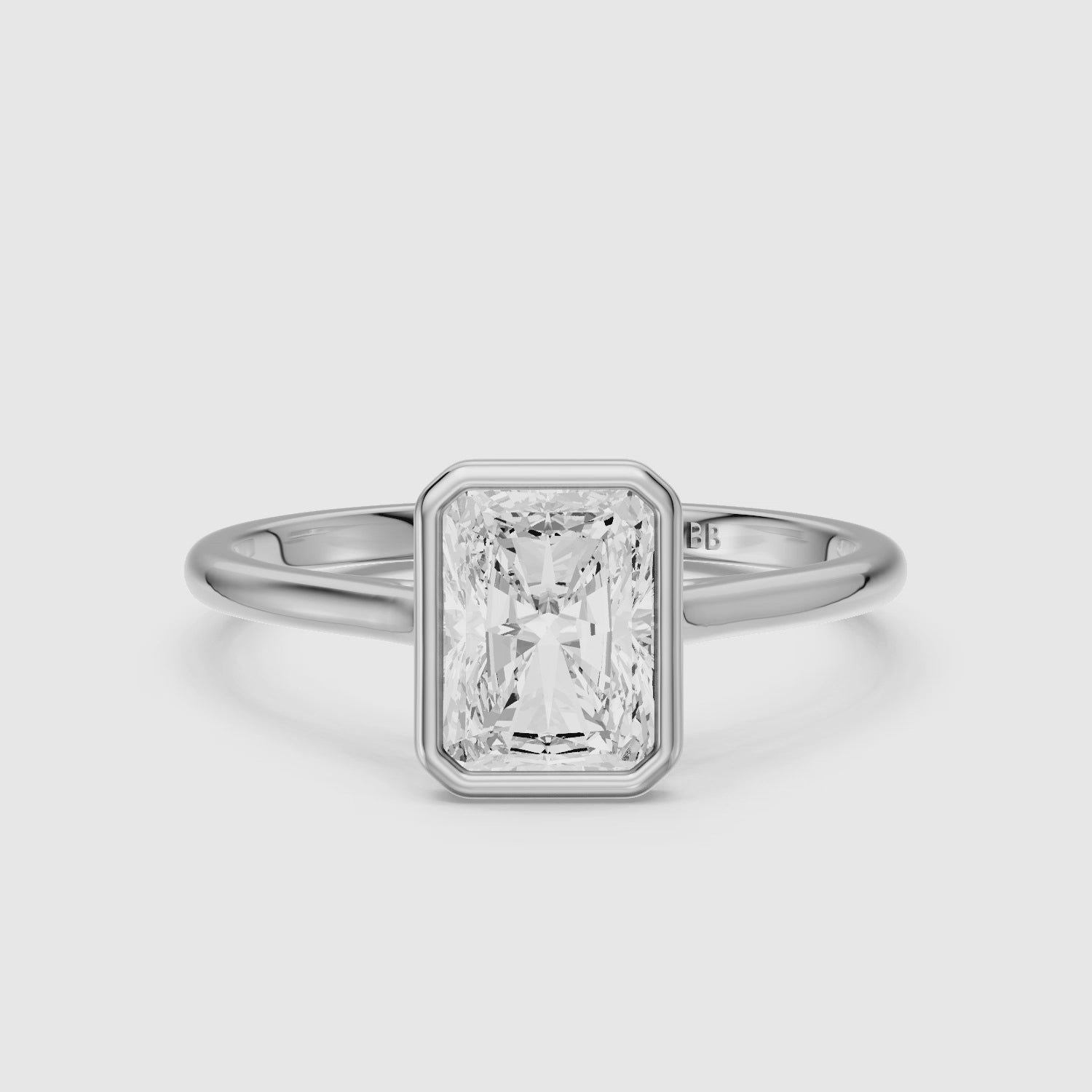Load video: Emmaly Radiant Cut Bezel Cathedral Style Moissanite Diamond Ring