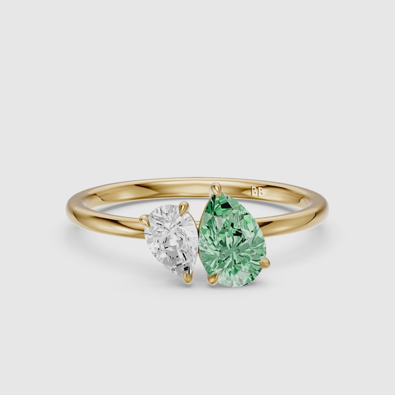 Load video: Irina Green and White Graduated Pear Shape Color Lab Grown Diamond Toi et Moi Ring