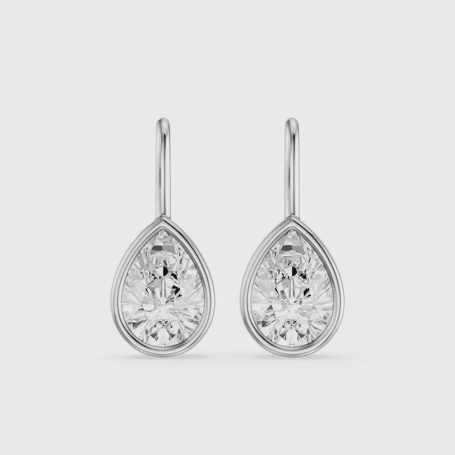 Load video: Brinley Bezel Set Pear Lab Grown Diamond Drop Earrings