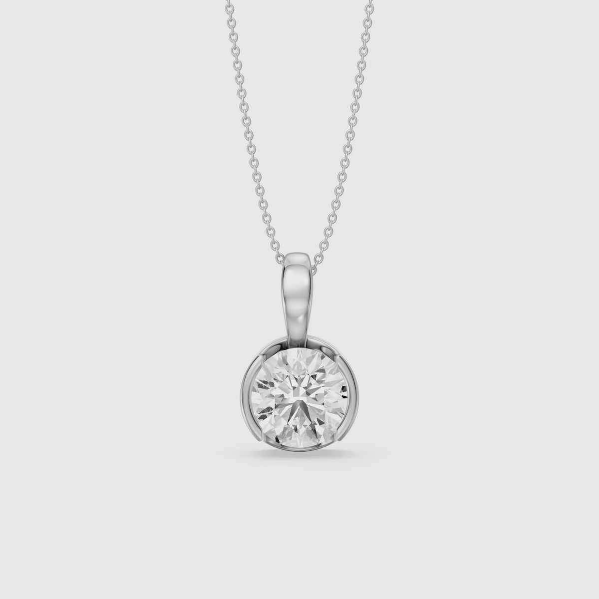 Load video: Morgan Round Lab Grown Diamond Half Bezel Solitaire Pendant