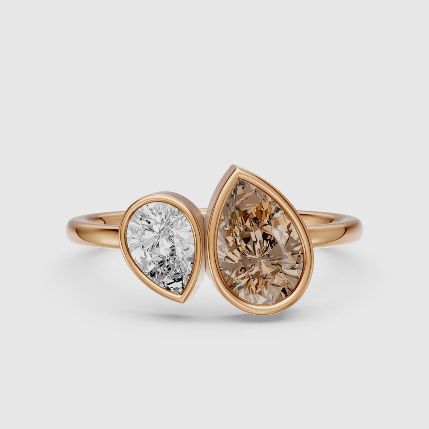 Load video: Ottilie Champagne and White Pear Cut Colored Lab Grown Diamond Toi et Moi Bezel Ring