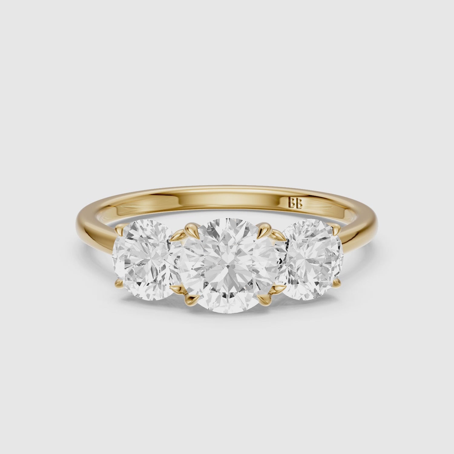 Load video: Kassie Round Cut Three Stone Cathedral Style Lab Grown Diamond Ring