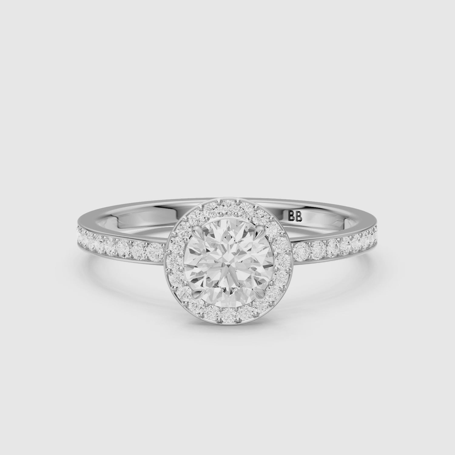 Load video: Jordyn Round Cut Halo Channel Set Lab Grown Diamond Ring