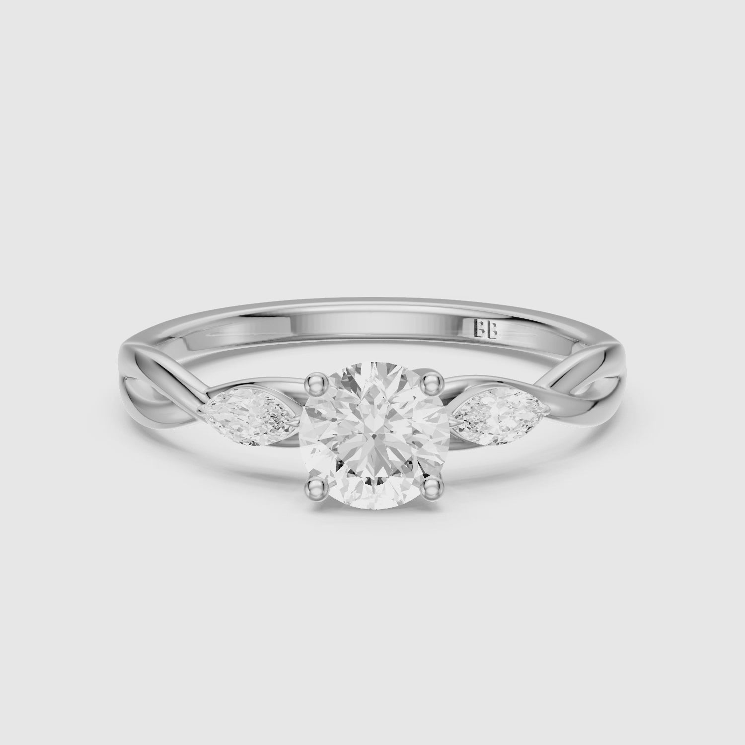 Load video: June Round Cut Side Stone Lab Grown Diamond Ring with Twisted Vine Band