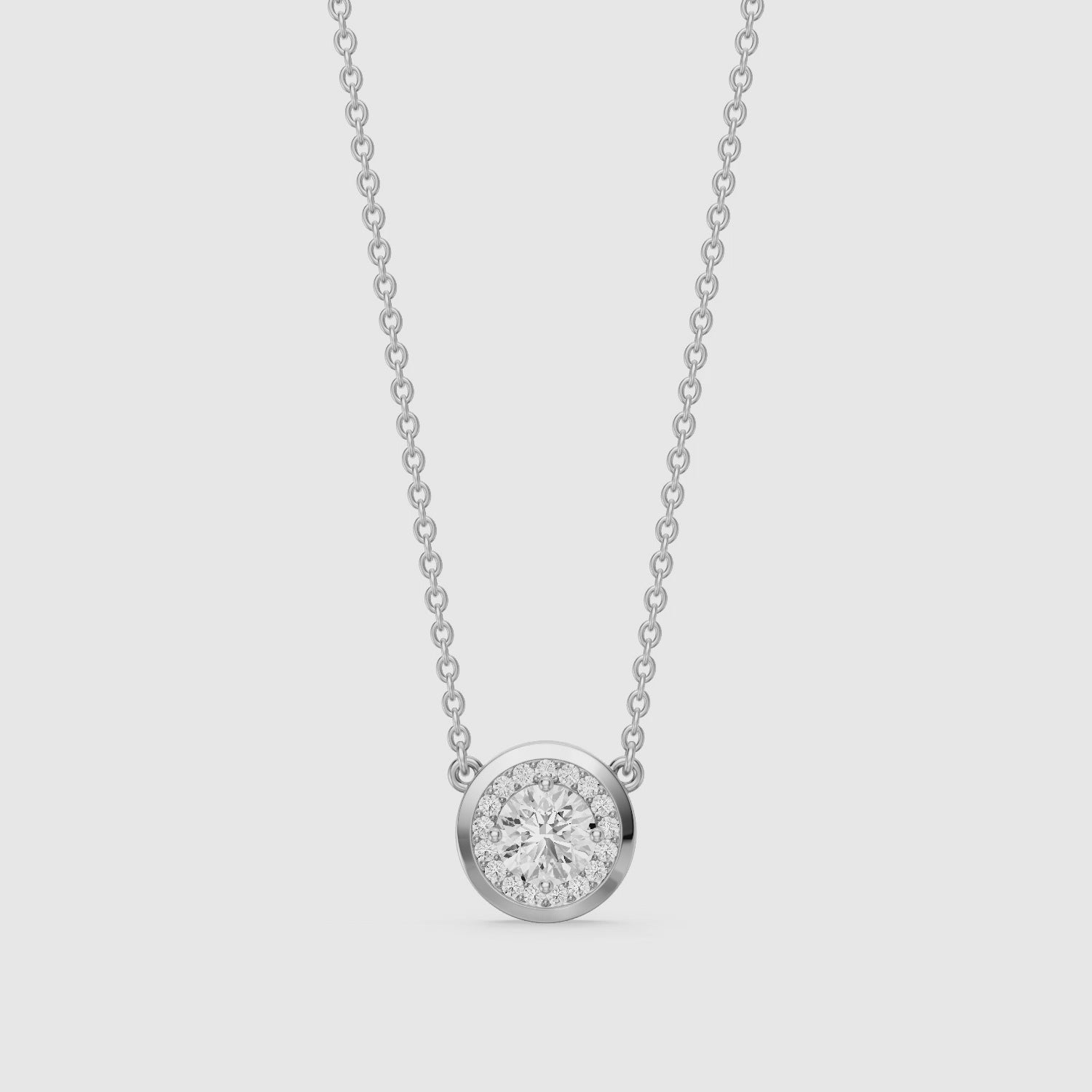 Load video: Marcella Bezel Set Round Lab Grown Diamond Halo Pendant
