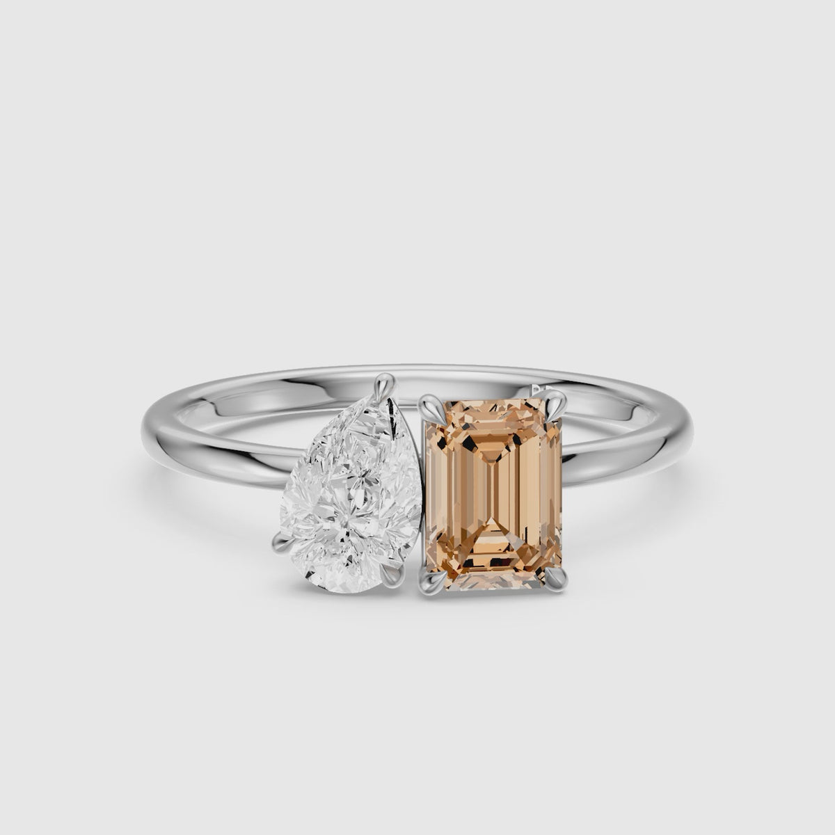 Load video: Bojana Champagne Emerald Cut and Pear Shape Color Lab Grown Diamond Toi et Moi Ring
