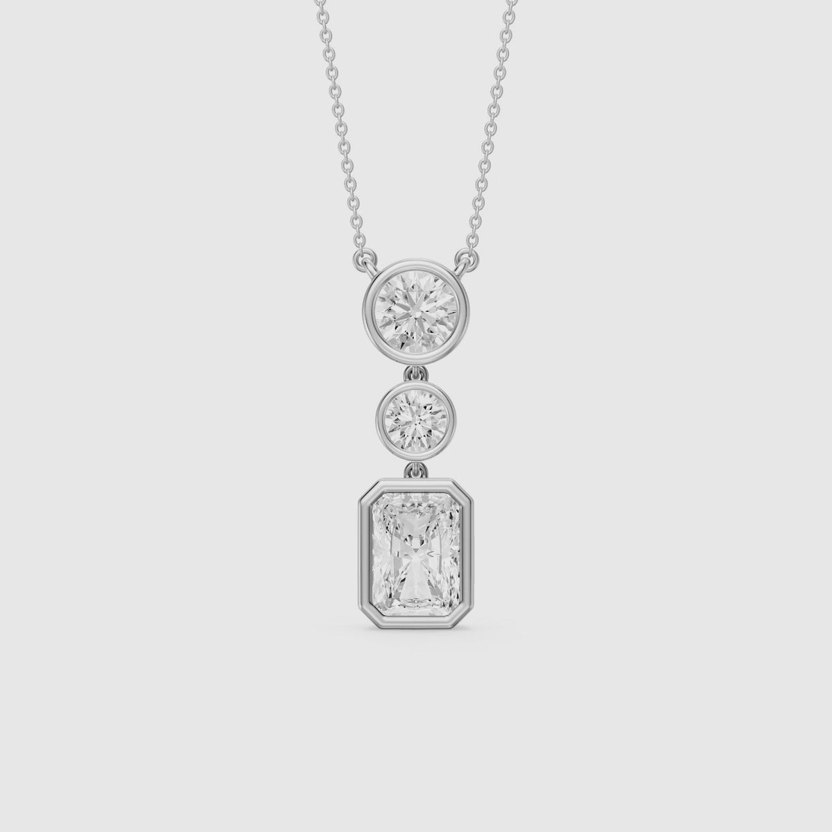 Load video: Laura Radiant Cut and Round Lab Grown Diamond Bezel Drop Pendant