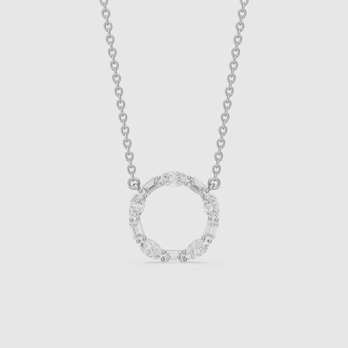 Load video: Tessa Emerald and Oval Lab Grown Diamond Circle Pendant