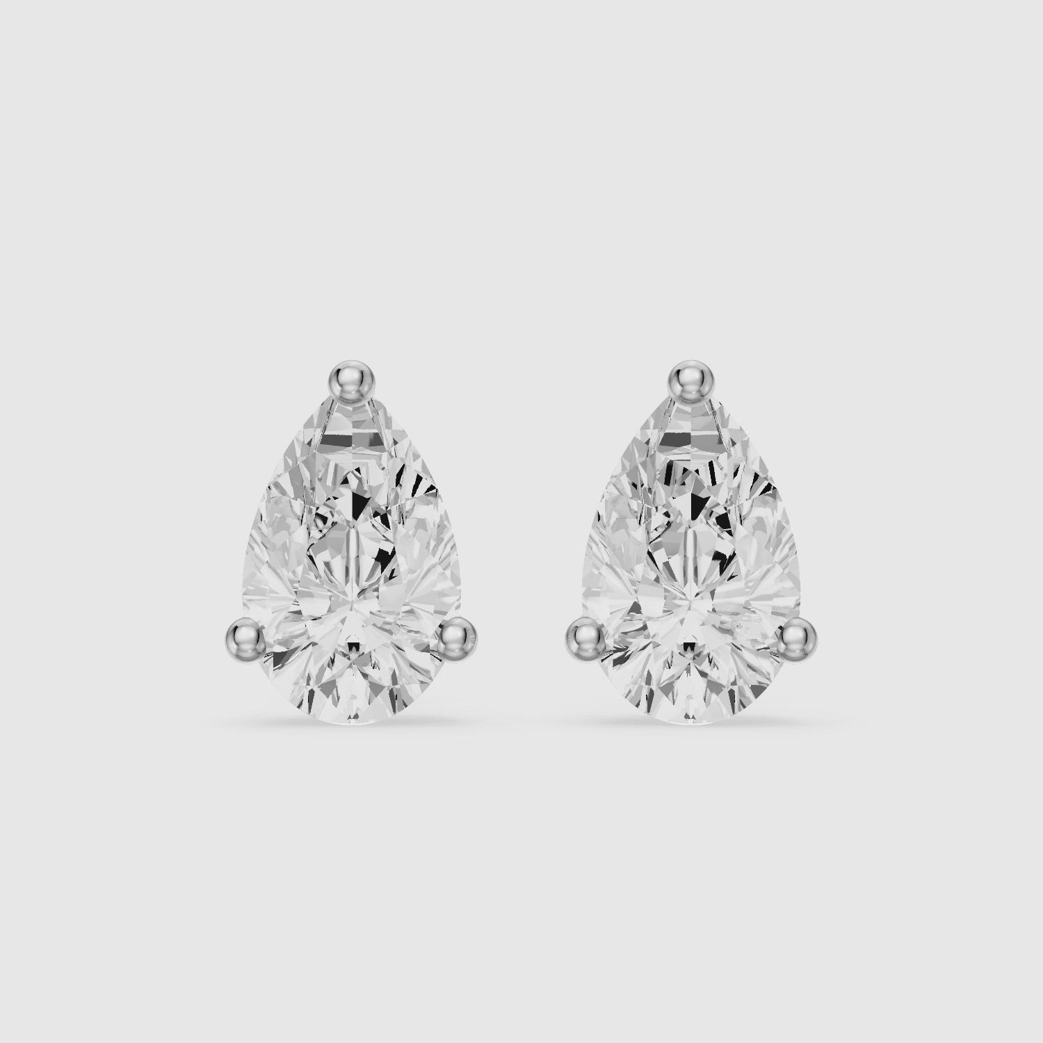 Load video: Eirlys Pear Cut Lab Grown Diamond Teardrop Solitaire Earrings