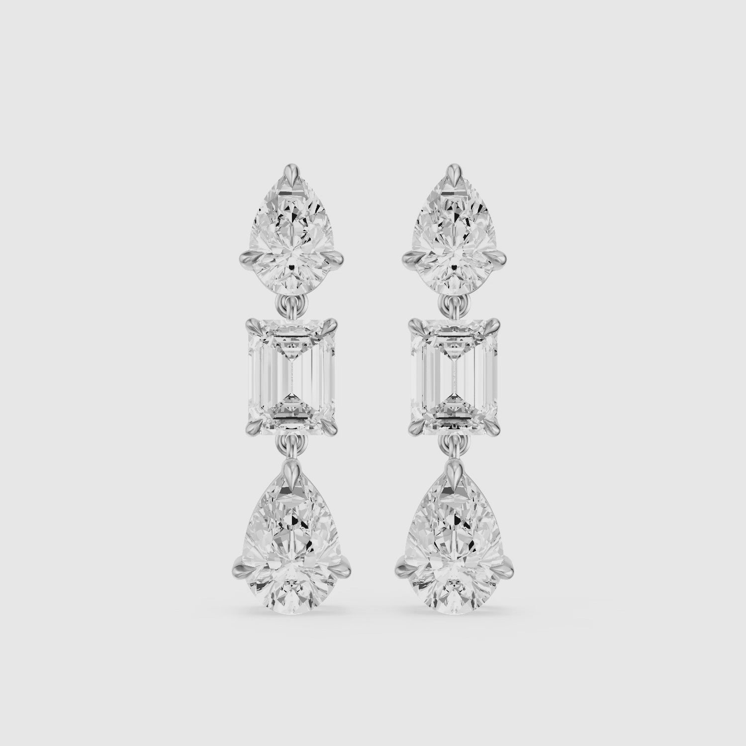 Load video: Acacia Emerald Cut and Pear Lab Grown Diamond Three Stone Drop Earrings