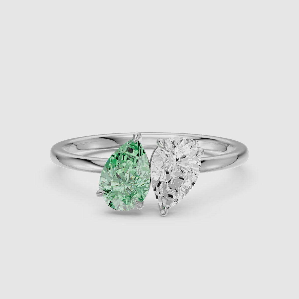 Load video: Asta Green and White Both Pear Cut Color Lab Grown Diamond Toi et Moi Ring