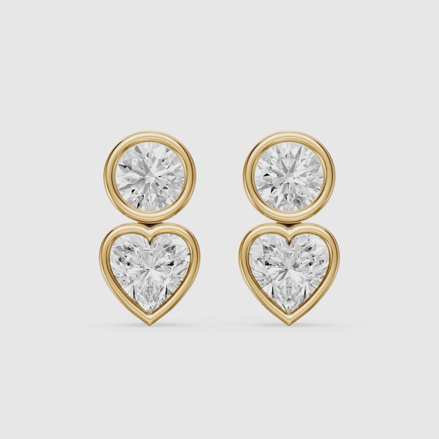 Load video: Veda Heart and Round Lab Grown Diamond Bezel Stud Earrings