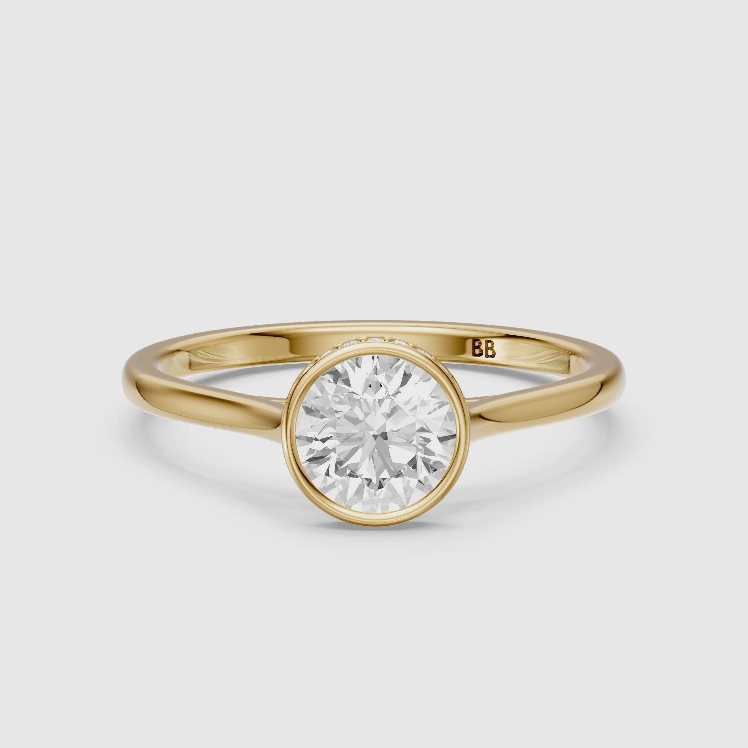 Load video: Kamryn Round Cut Bezel Set Hidden Halo Lab Grown Diamond Ring